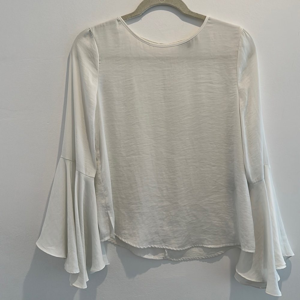 White blouse with flowing arms